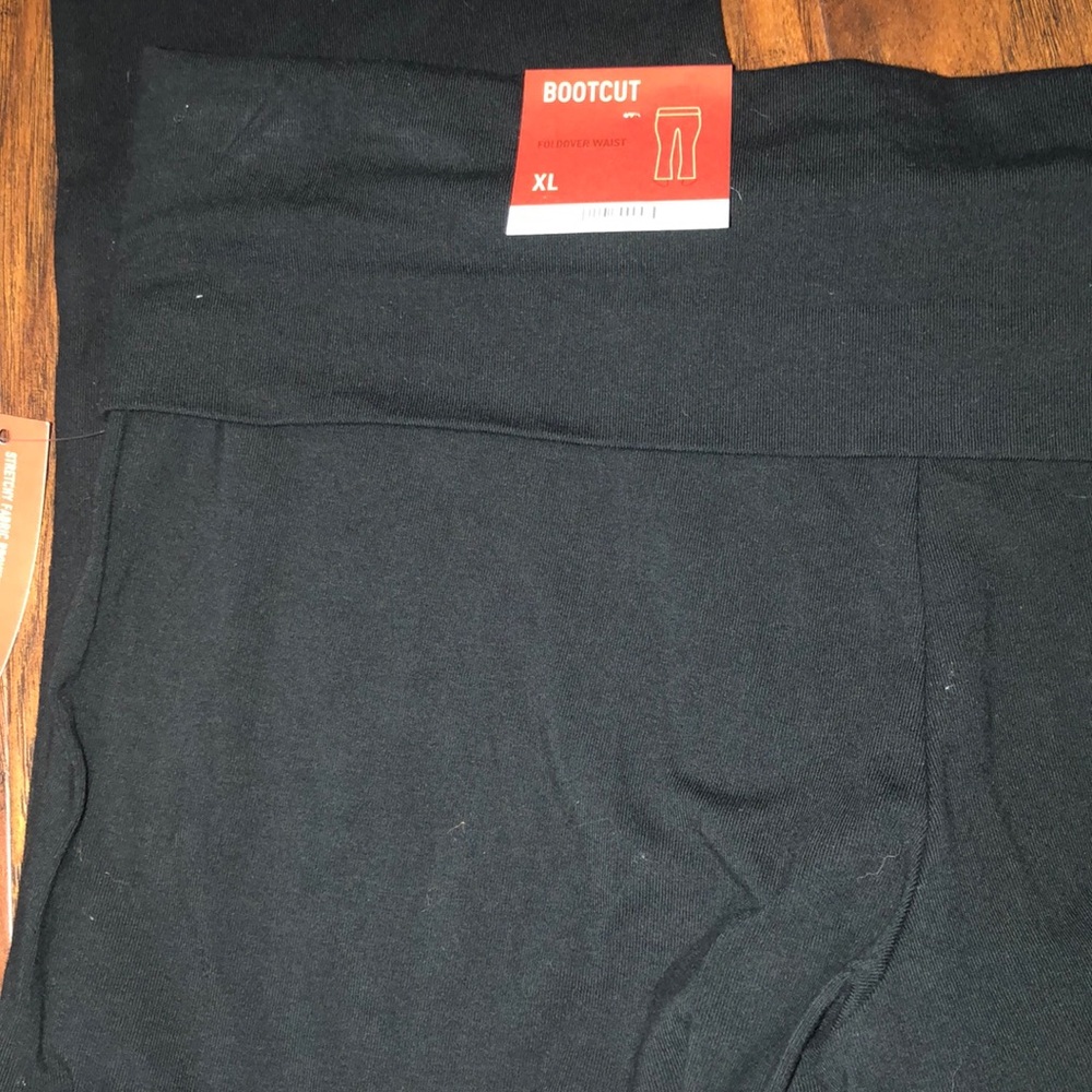 Black boot cut yogi pants .